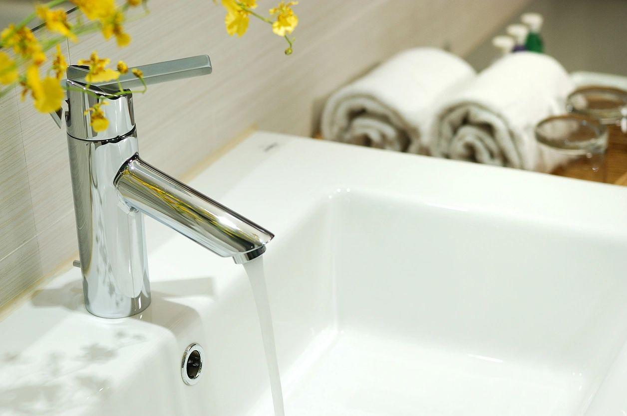 Modern bathroom faucet with clean running water